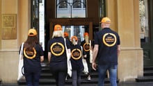World Animal staff walking into Expedia office