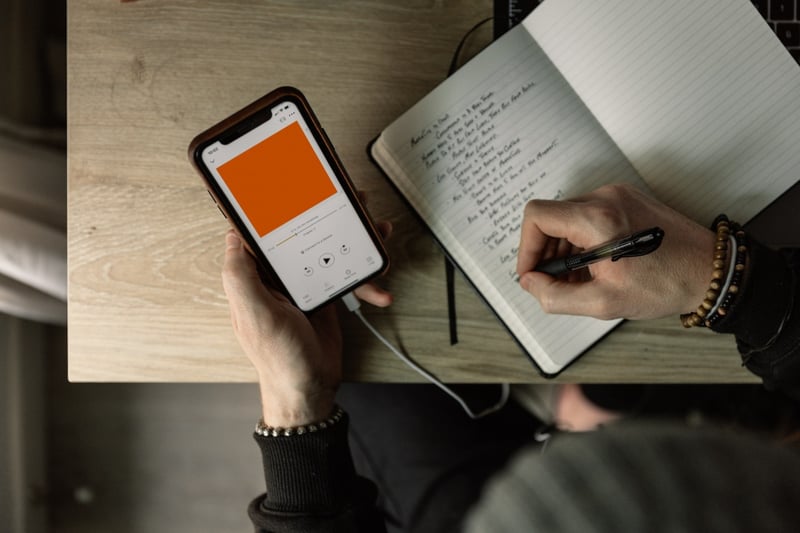 Phone with podcast on.